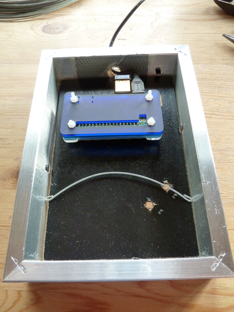 Pi Zero on backing plate in frame