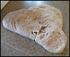Dough being kneaded by hand